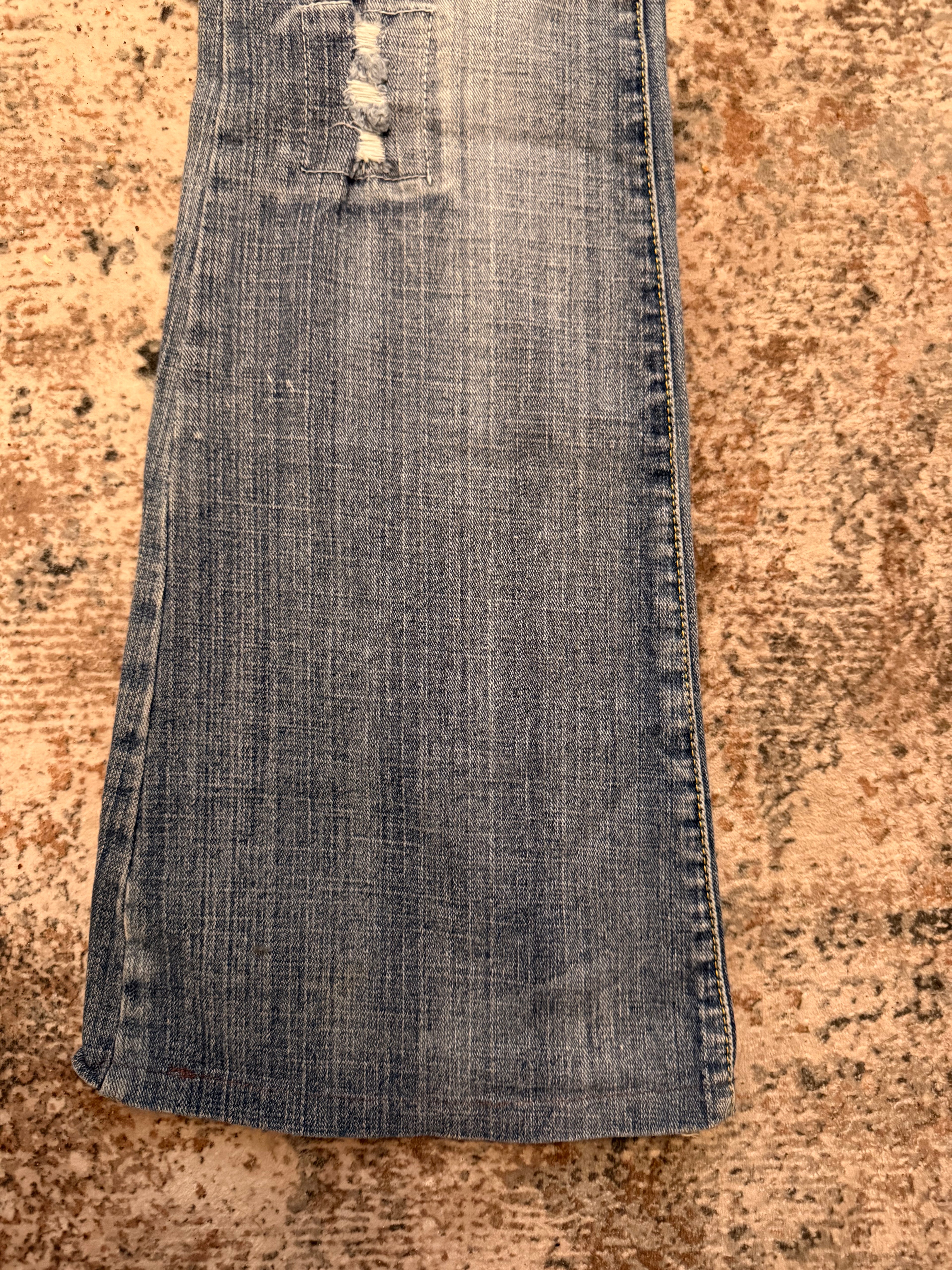 The Distressed Flare Denim